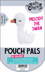 Packaging for Knitty Critters Pouch Pals crochet kit featuring an image of a white swan and the text 'MELODY THE SWAN', with additional details about the kit contents.